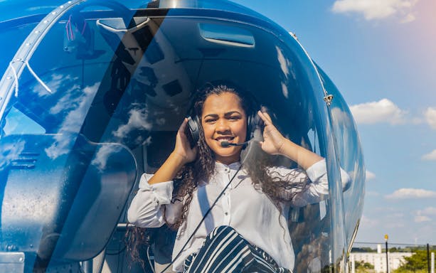 Person inside helicopter preparing for Venice lagoon tour.