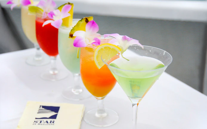 Colorful cocktails with tropical garnishes on the Star Independence Day Cruise, Hawaii.