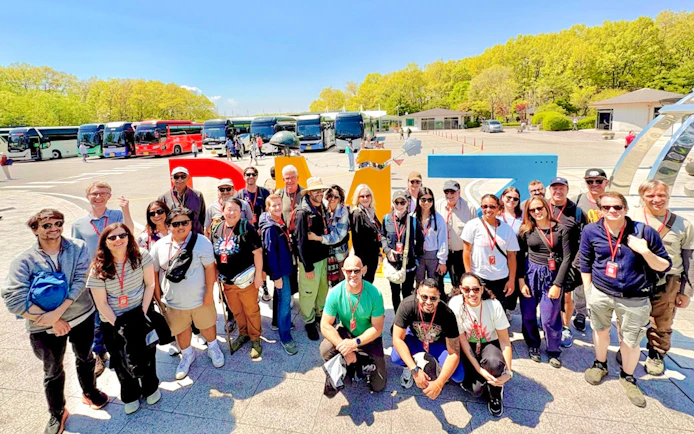 Tour group at DMZ sculpture, Imjingak tourist area, South Korea.