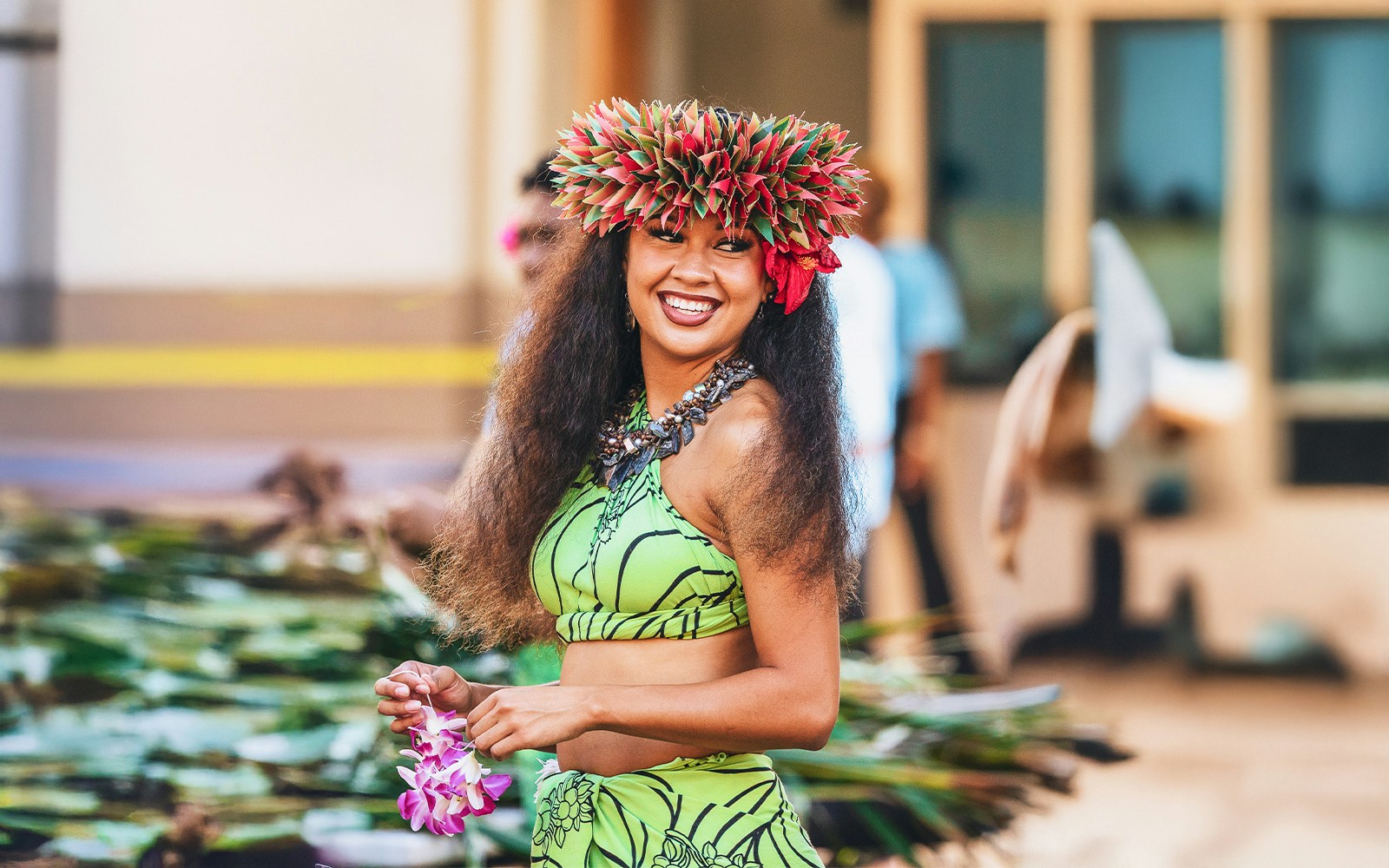 Performer in traditional attire at Moana Luau, Hawaii.