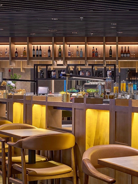 Plaza Premium Lounge seating and bar area at Kuala Lumpur International Airport.