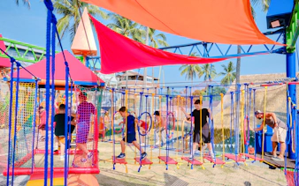 Children navigating rope obstacles at Ko Fun Kids Rope Park, Phuket.