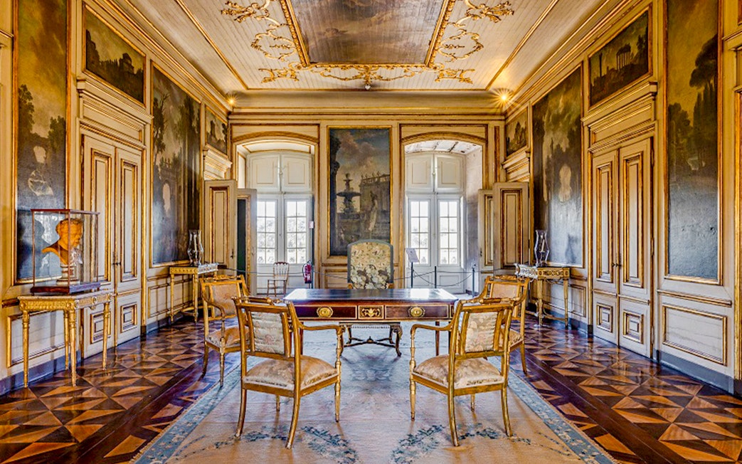 National Palace of Queluz Dispatch Room with ornate decor and antique furniture.