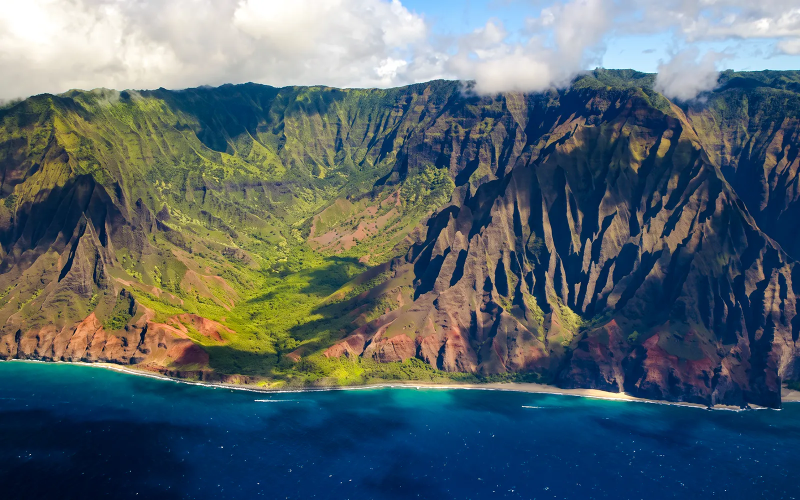 Aerial view of Na Pali Coast cliffs and ocean on Kauai, Hawaii.