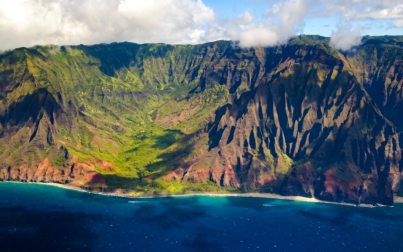 Aerial view of Na Pali Coast cliffs and ocean on Kauai, Hawaii.