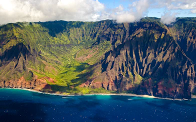 Aerial view of Na Pali Coast cliffs and ocean on Kauai, Hawaii.