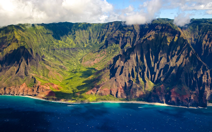 Aerial view of Na Pali Coast cliffs and ocean on Kauai, Hawaii.