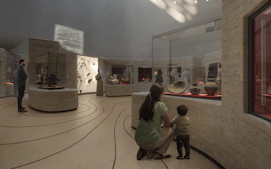 Mom and child viewing exhibits at Zayed National Museum.