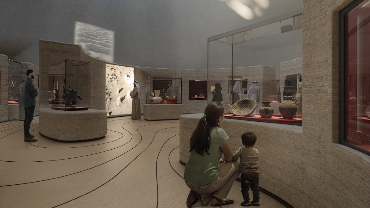 Mom and child viewing exhibits at Zayed National Museum.