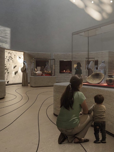 Mom and child viewing exhibits at Zayed National Museum.