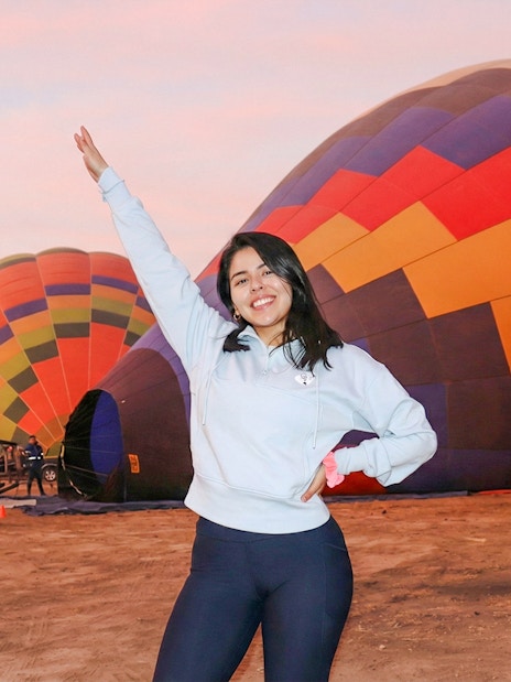Hot air balloons preparing for flight at sunrise near Teotihuacán.