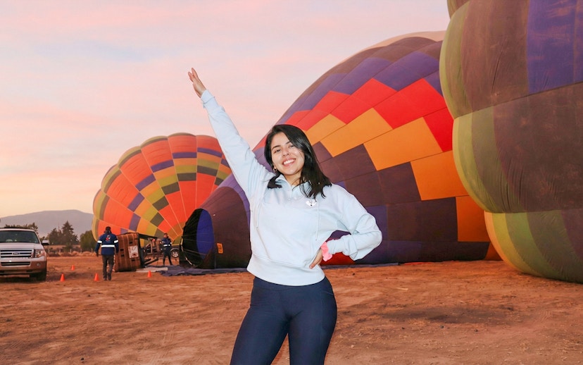 Hot air balloons preparing for flight at sunrise near Teotihuacán.