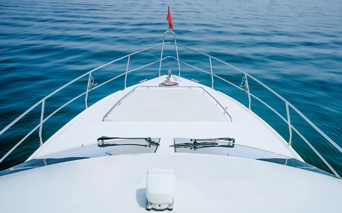 Luxury yacht bow on calm sea, Dubai.