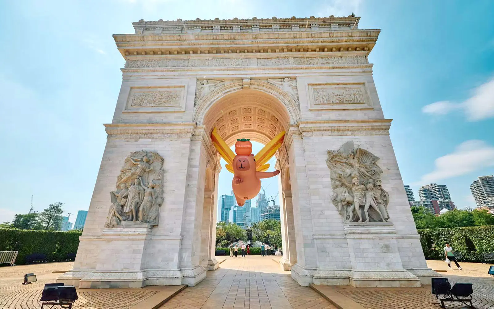 Replica of Arc de Triomphe with inflatable character at Window of the World, Shenzhen, China.