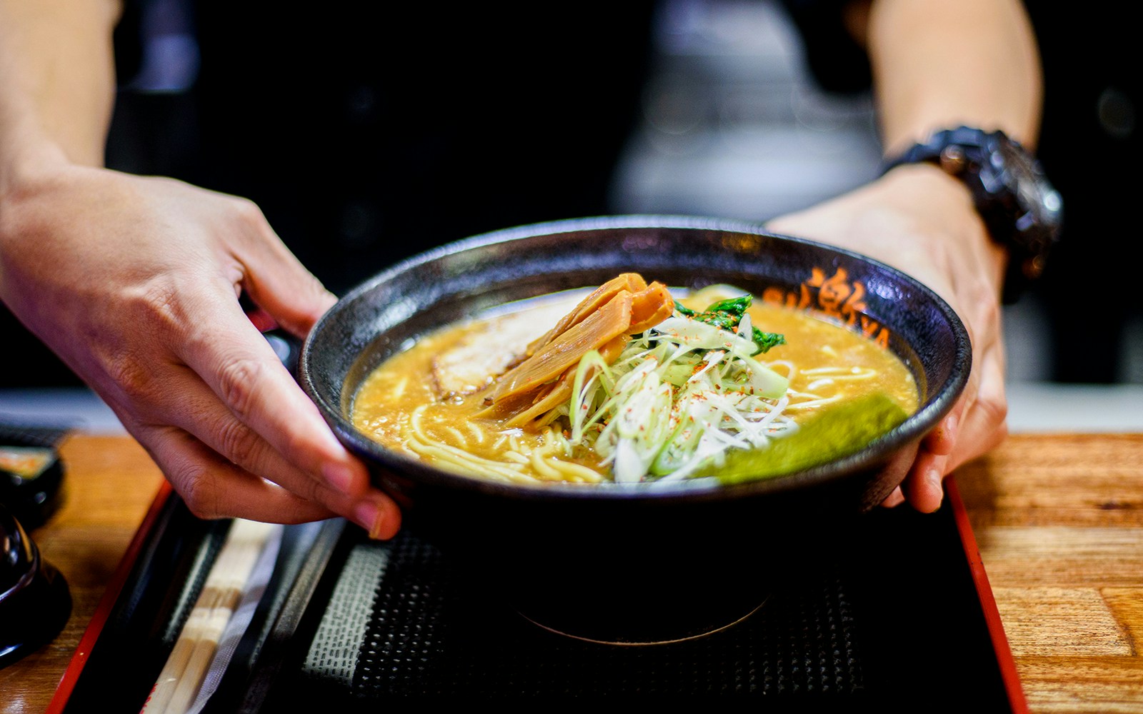 Ramen bowl being served at Ramen Factory Kyoto cooking class.