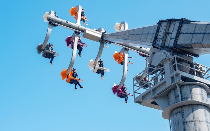 Visitors on a thrilling ride at The Land of Legends Theme Park.