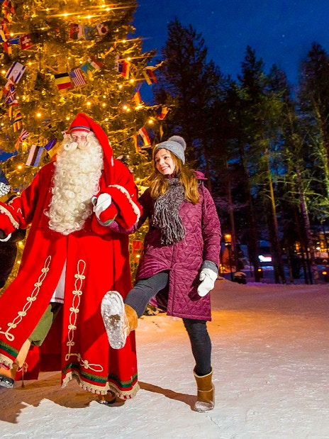 Children with Santa Claus at Santa Claus Village, Rovaniemi, Finland.
