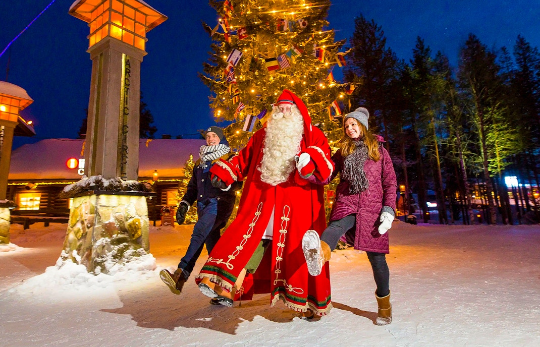 Children with Santa Claus at Santa Claus Village, Rovaniemi, Finland.