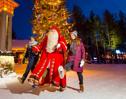 Children with Santa Claus at Santa Claus Village, Rovaniemi, Finland.