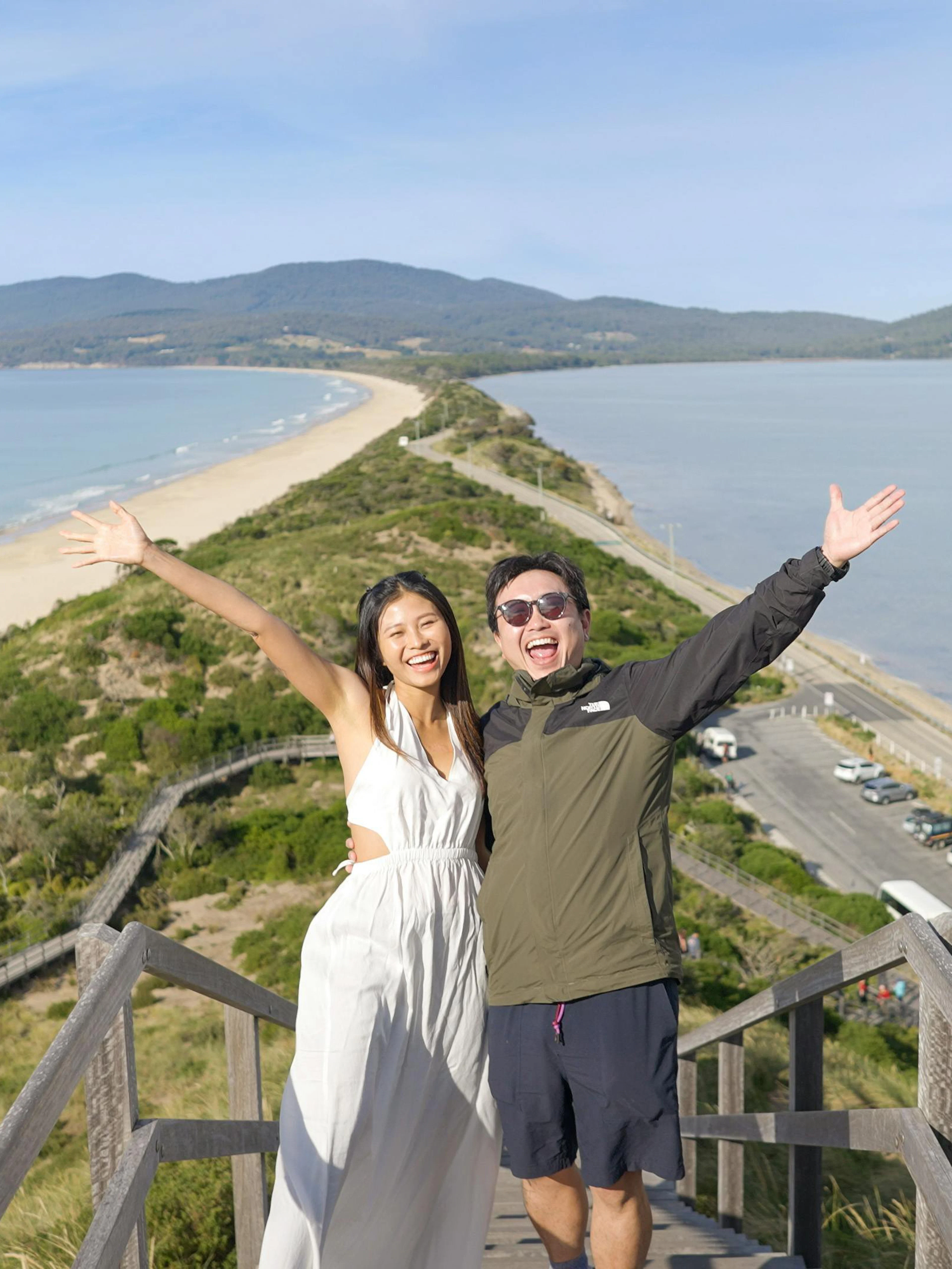 Couple enjoying the view from the Neck Lookout on Bruny Island, Tasmania.