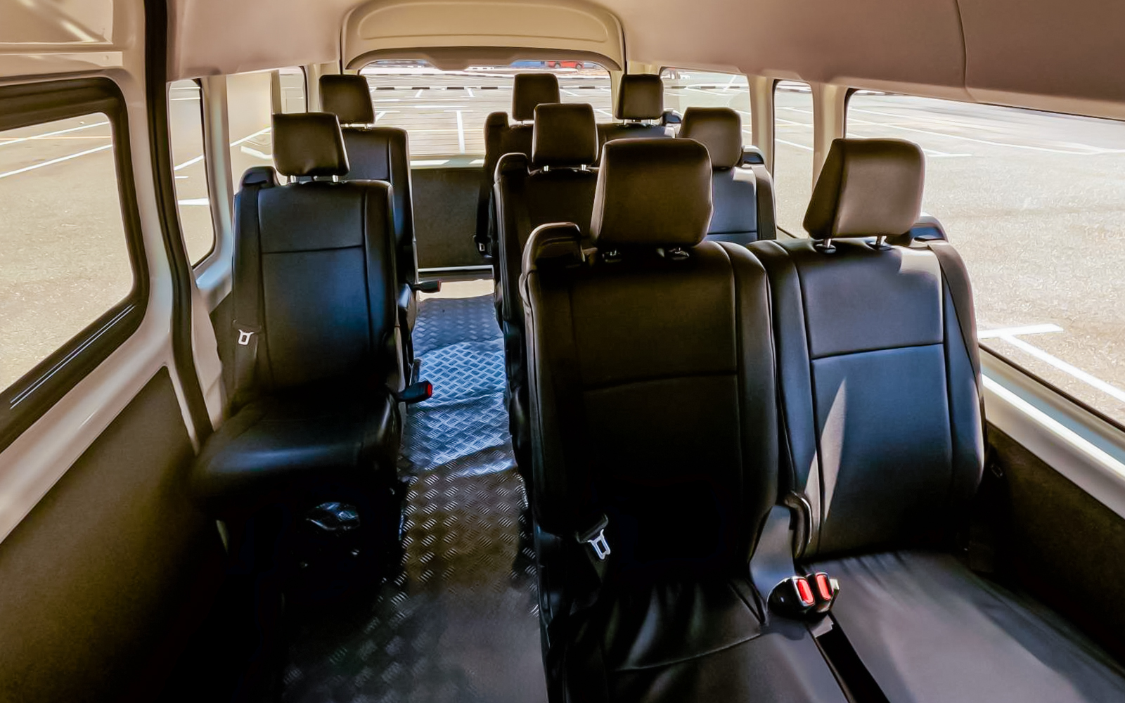 Interior of a shuttle bus for Aquaventure Waterpark transport service.