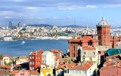 Fener and Balat neighborhoods with Phanar Greek Orthodox College, Istanbul skyline in background.