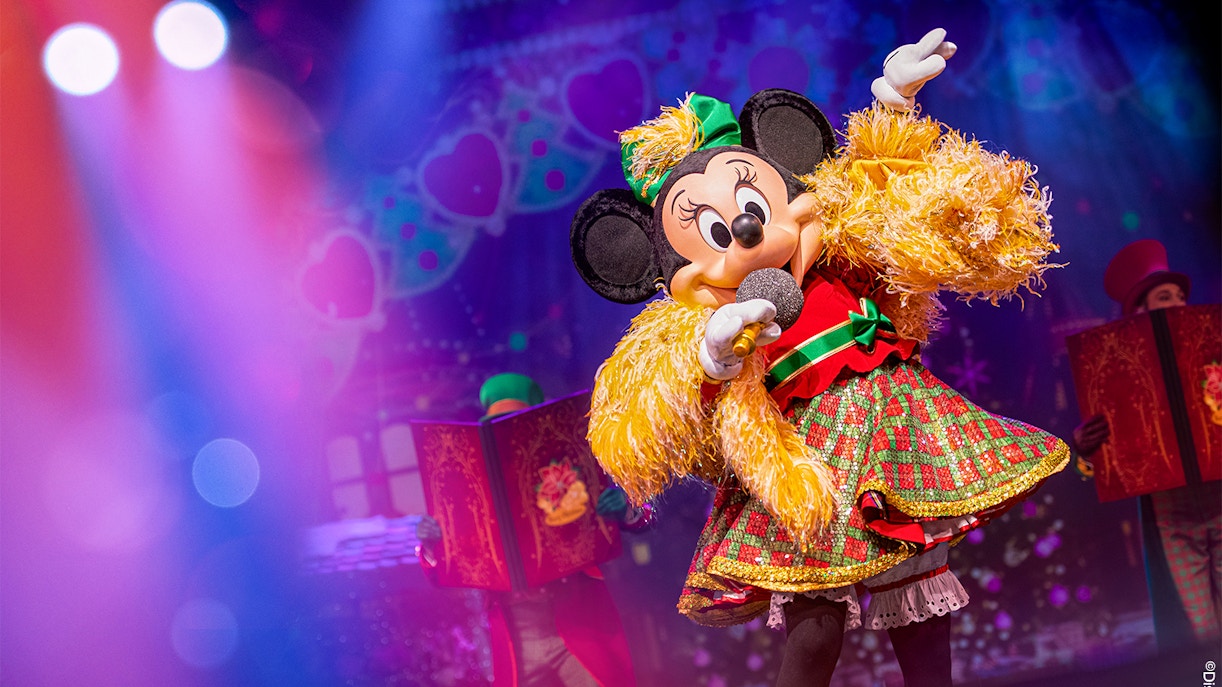 Minnie Mouse performing on stage during Disneyland Paris parade show.