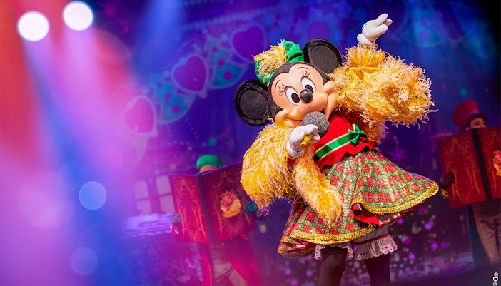 Minnie Mouse performing in Disneyland Paris parade during Minnie's Musical Moment show.