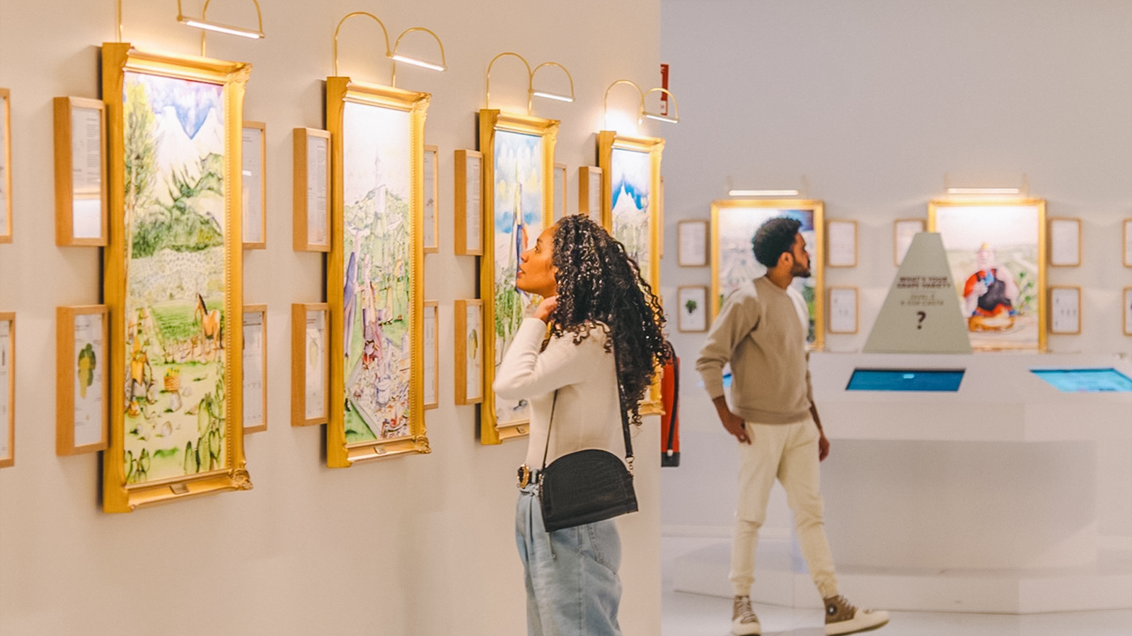 Visitors exploring art gallery during The Wine Experience tour.
