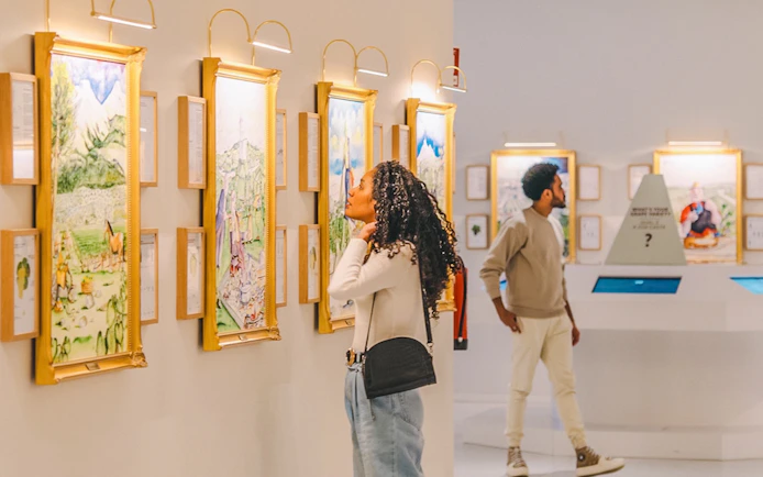 Visitors exploring art gallery during The Wine Experience tour.