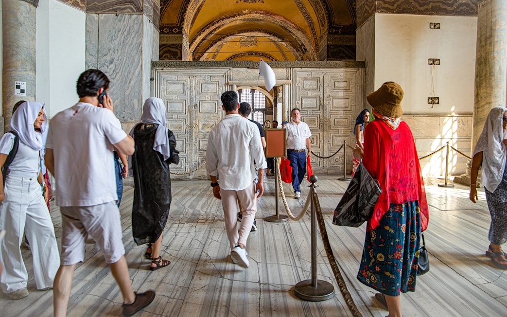 Visitors on a guided tour inside Hagia Sophia, Istanbul.