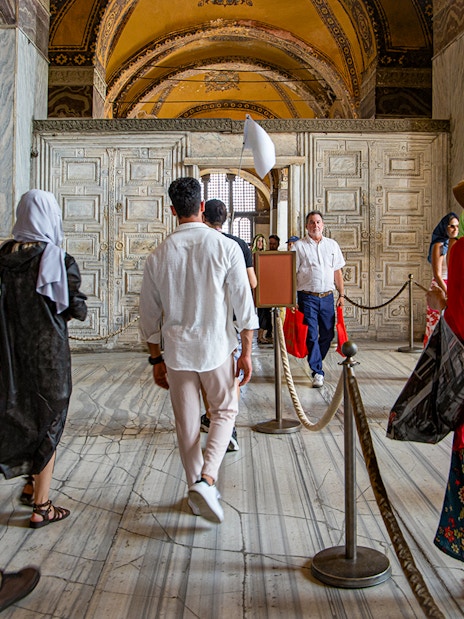 Visitors on a guided tour inside Hagia Sophia, Istanbul.
