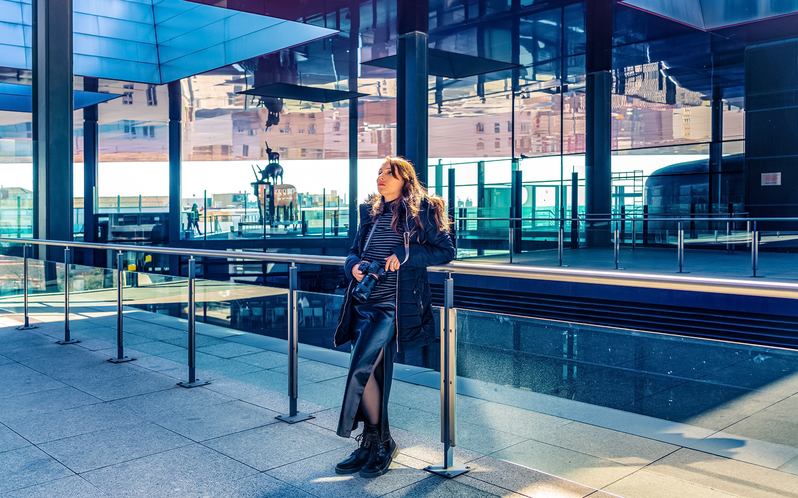 Woman viewing artwork at Reina Sofia Museum, Madrid.