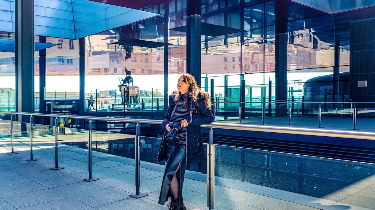 Woman viewing artwork at Reina Sofia Museum, Madrid.