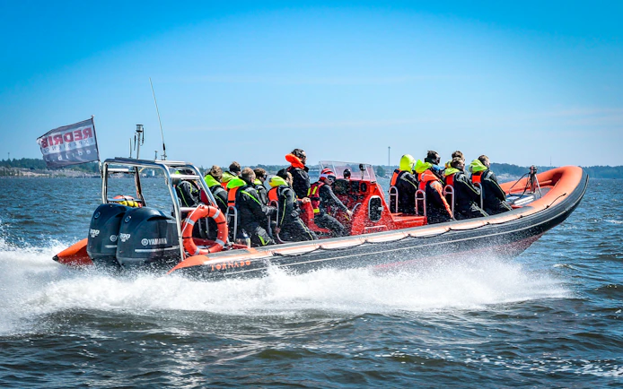 Guided RIB boat tour with passengers exploring Helsinki's outer islands.