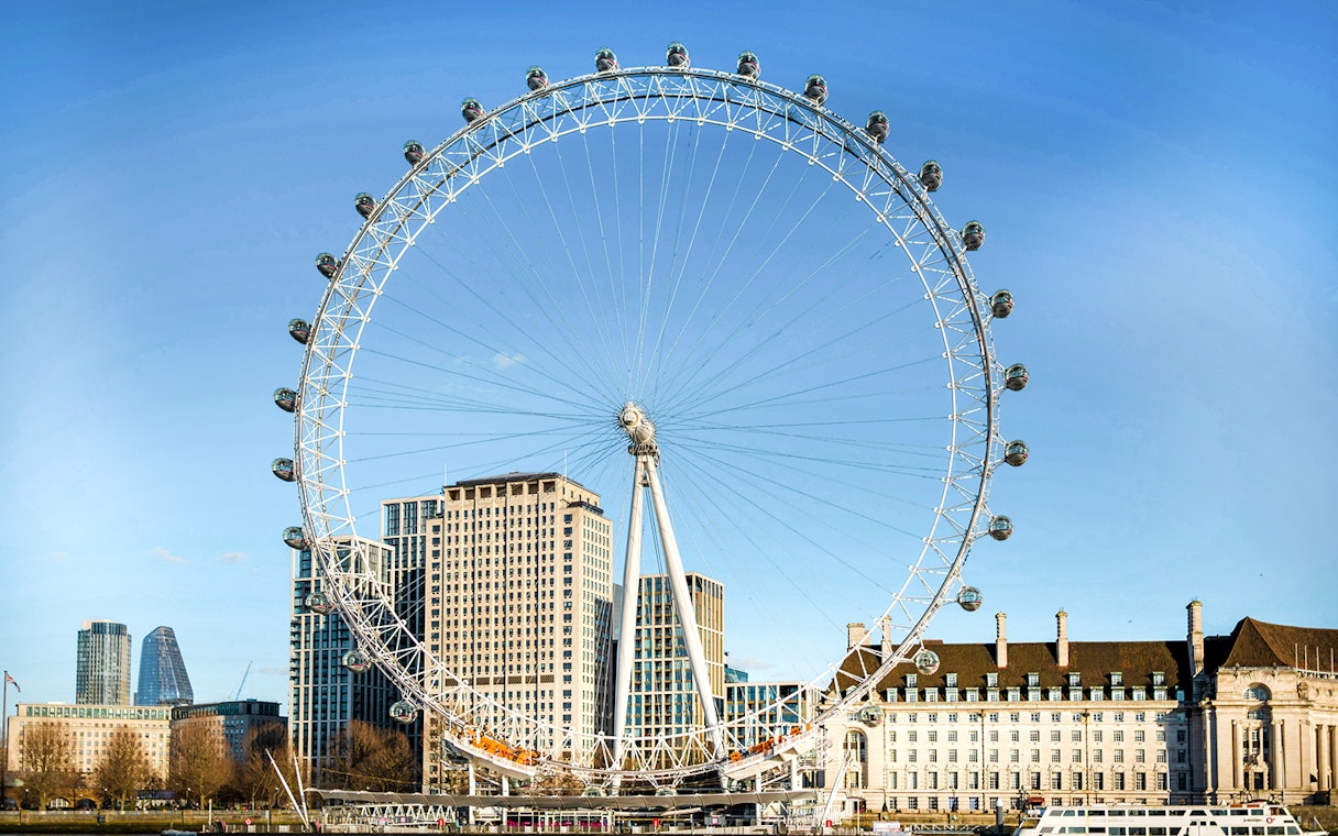 London Eye with city skyline in the background, part of combo tour with Madame Tussauds and SEA LIFE.