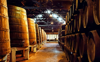 Barrels aging Port wine at Caves Ferreira in Vila Nova de Gaia, Portugal.