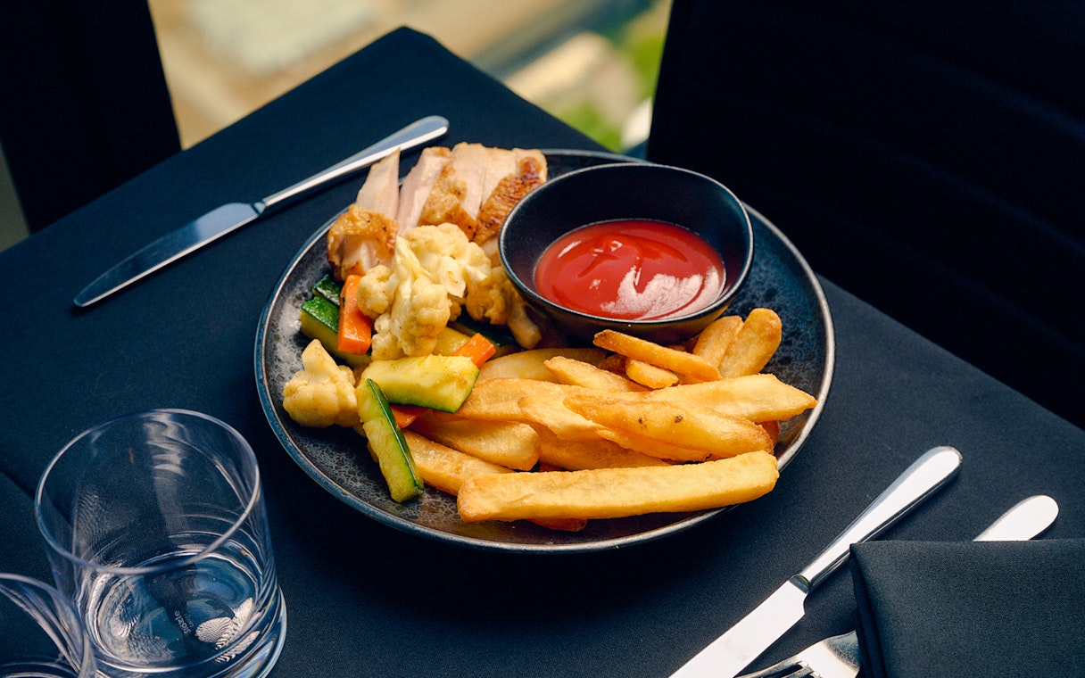 Children's menu with fries and vegetables at Melbourne Skydeck dining experience.