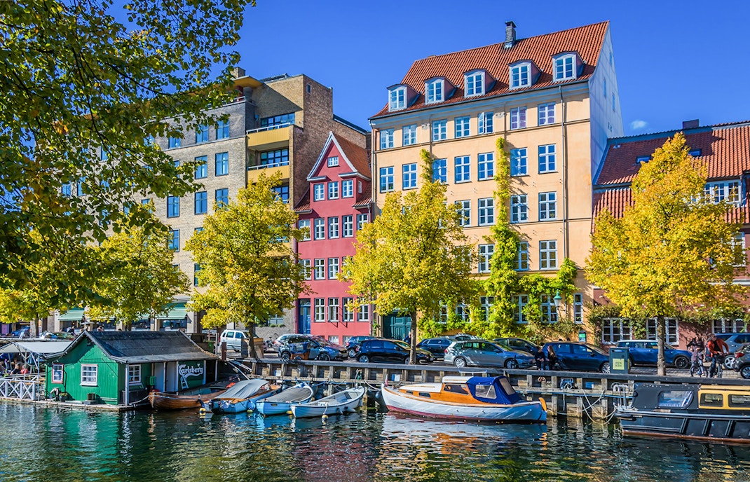 Colorful buildings and boats along the canal in Christianshavn, Copenhagen.