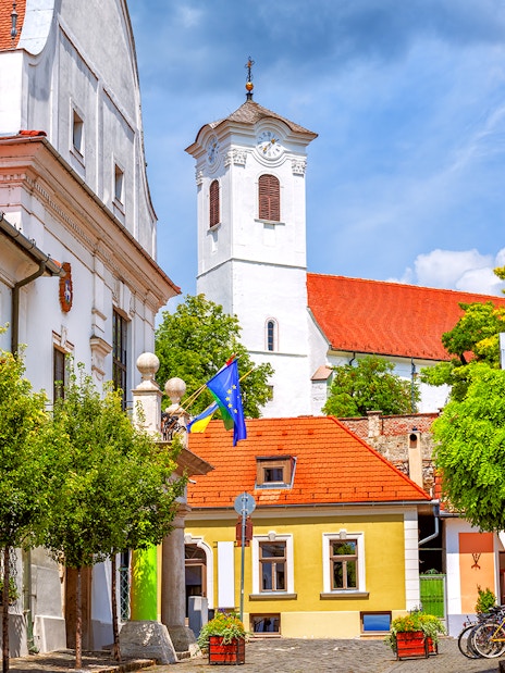 Colorful buildings and church tower in Szentendre, Hungary, along the Budapest to Szentendre tour route.