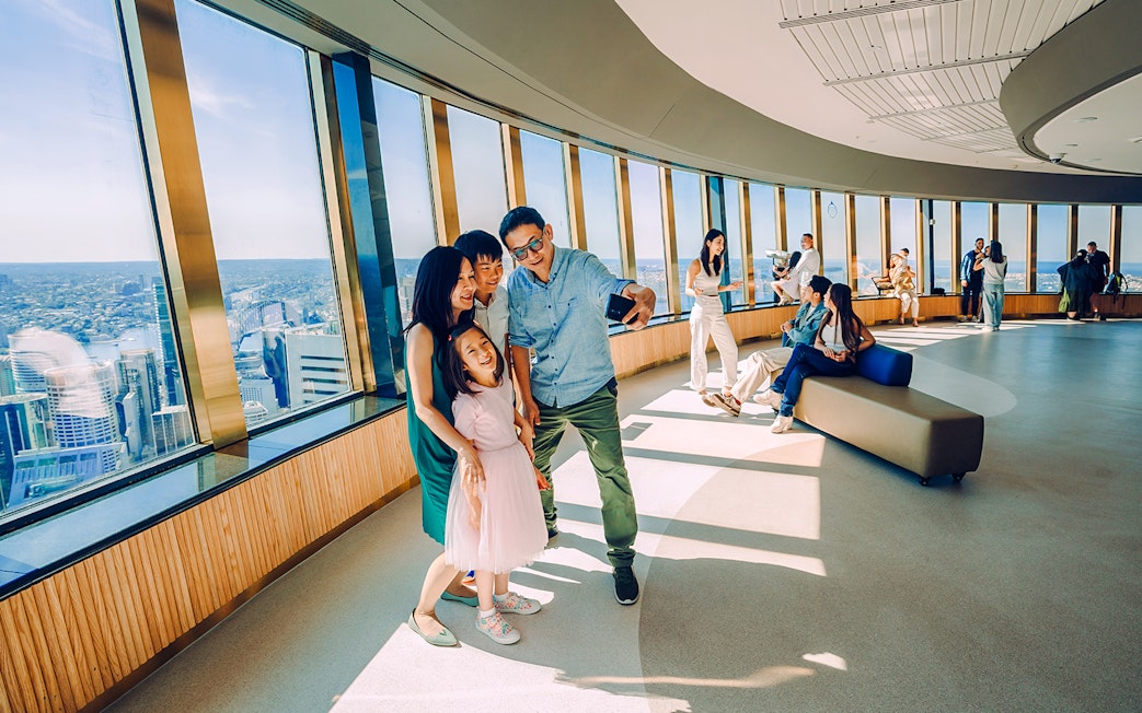 Family taking a selfie on the viewing deck of Sydney Tower Eye.