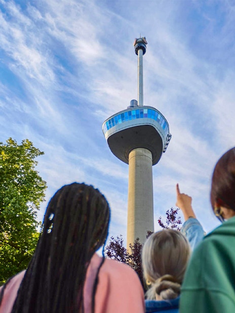 Guests looking up at the Euromast tower entrance in Rotterdam.