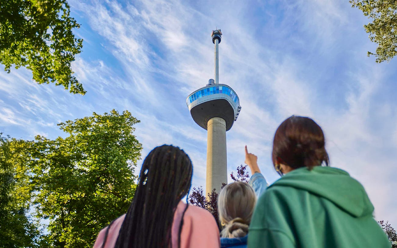 Guests looking up at the Euromast tower entrance in Rotterdam.
