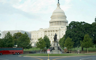 U.S. Capitol building with a statue in the foreground, Washington DC.