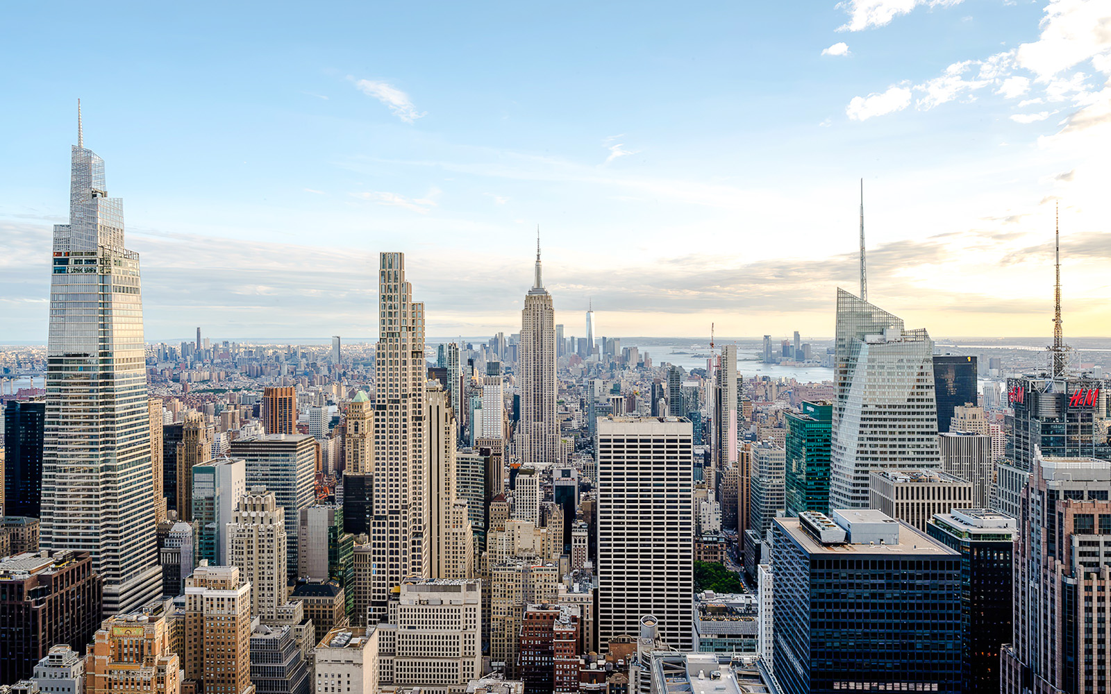 New York City skyline view from Top of the Rock, featuring the Empire State Building.