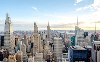 New York City skyline view from Top of the Rock, featuring the Empire State Building.