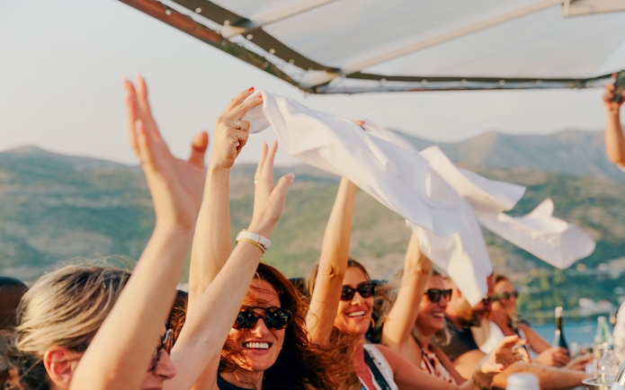 Guests celebrating during Dinner in the Sky experience in Dubrovnik.