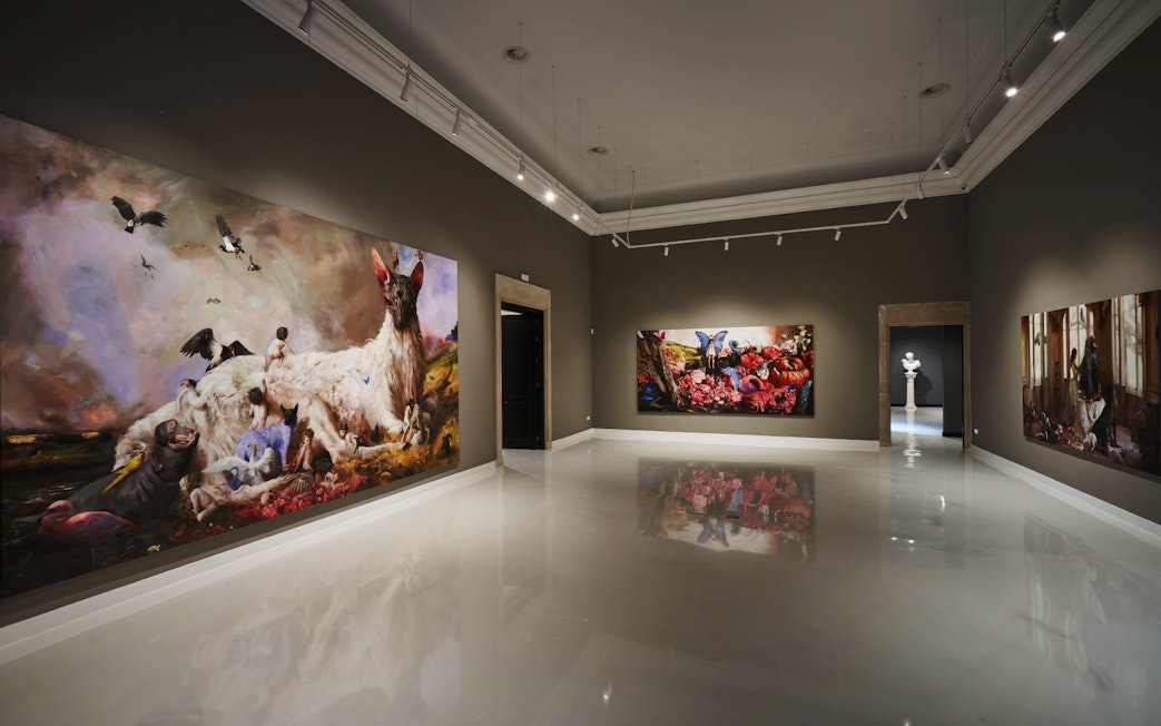 Contemporary art gallery at Moco Museum, Barcelona, featuring large colorful paintings.