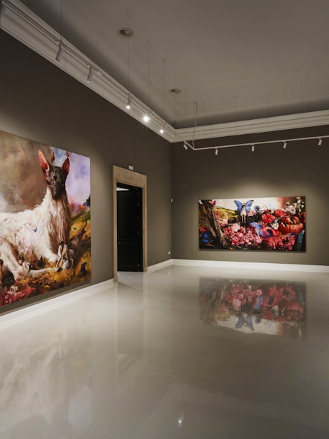 Contemporary art gallery at Moco Museum, Barcelona, featuring large colorful paintings.