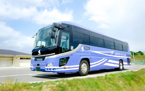 Kansai Airport transfer bus parked at terminal.